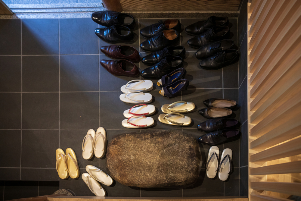 Leather,Shoes,And,Traditional,Japanese,Sandals,Arranged,In,Entryway