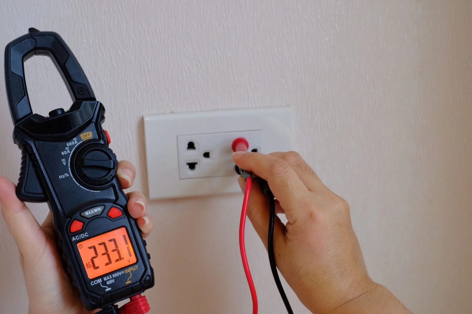 an-electrician-is-a-hand-holding-on-the-digital-mu
