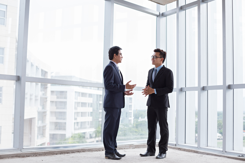 Business,Partners,Talking,Inside,The,Building,Under,Construction
