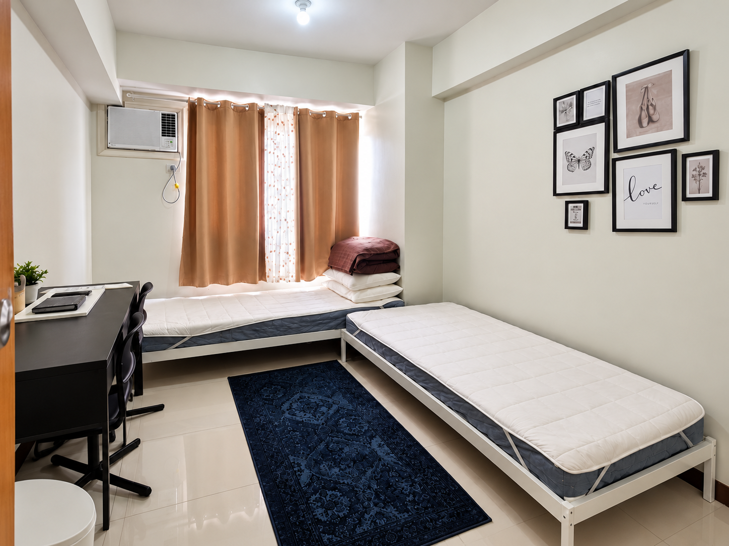 Minimalist Bedroom with Twin Beds and Gallery Wall