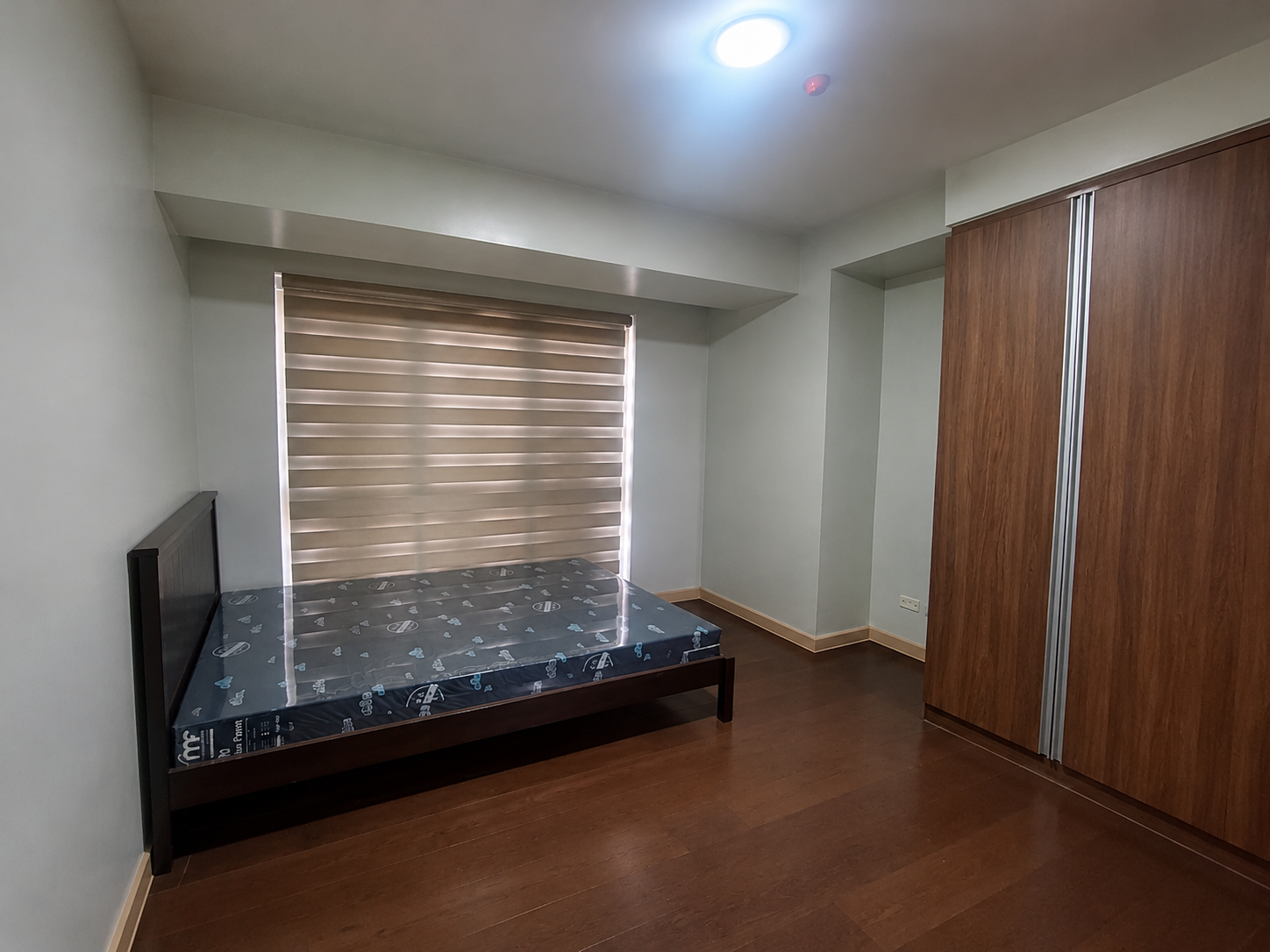Wide-Angle Minimalist Bedroom Interior
