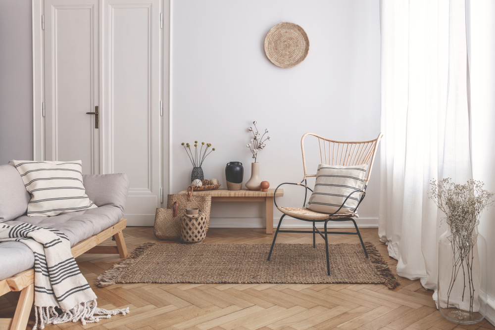 Armchair,On,Rug,Next,To,Bench,With,Plants,In,White