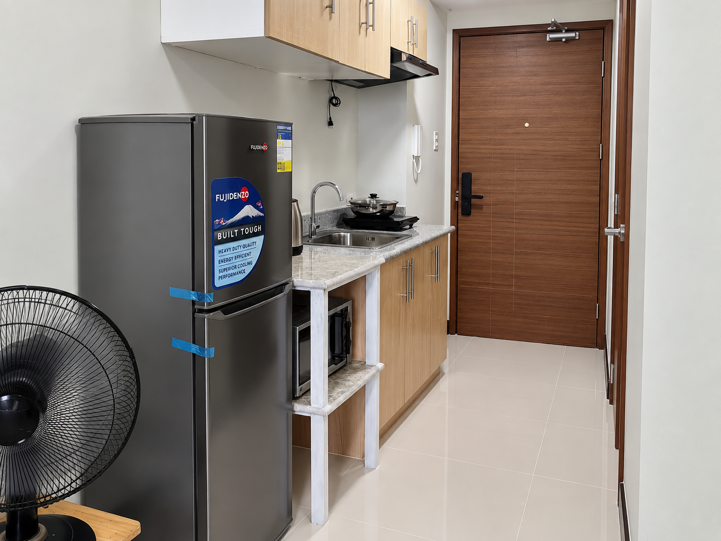 Compact Kitchenette Entryway with Retro Appliances
