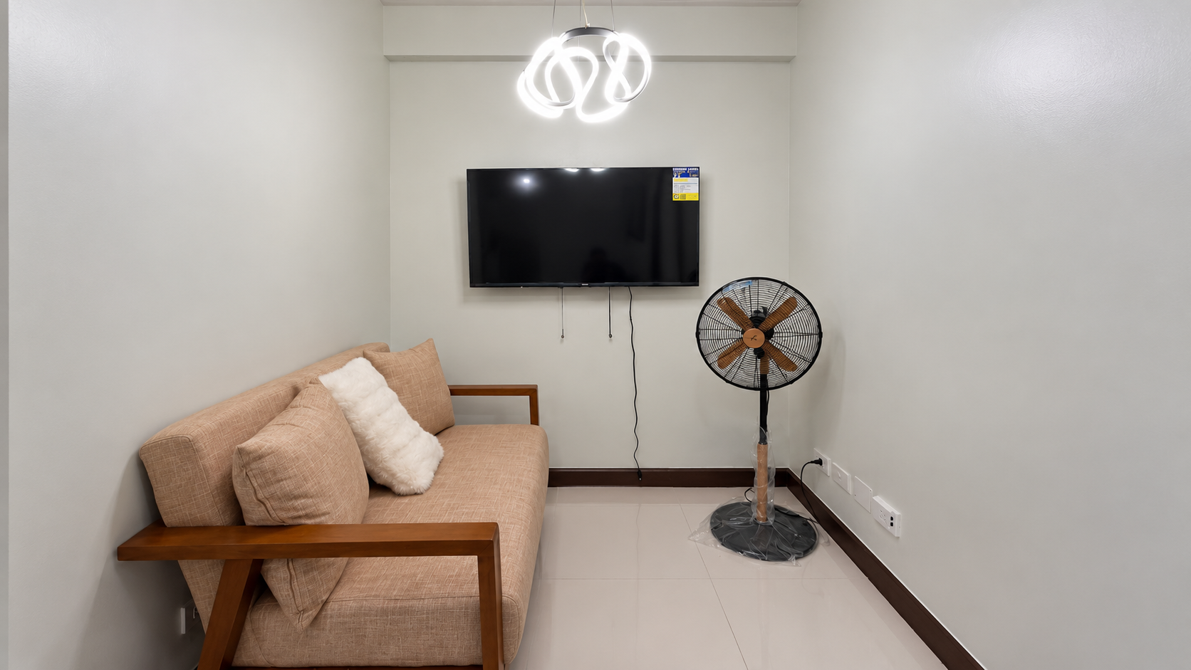 Minimalist Living Nook with TV and Fan