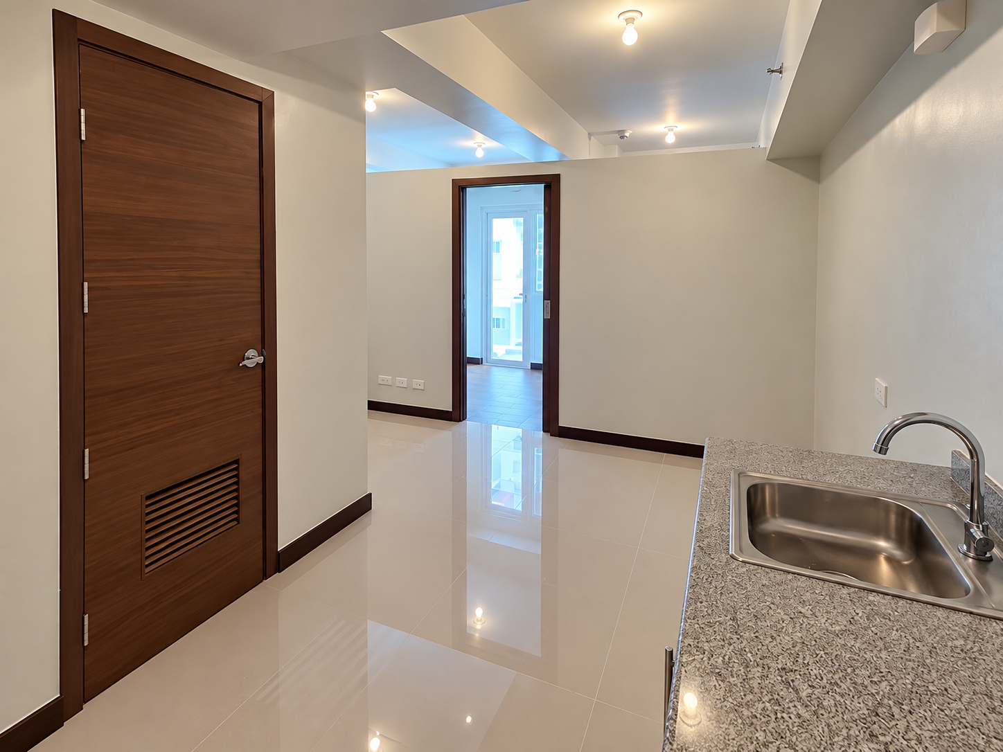 Modern Empty Apartment Hallway and Kitchenette