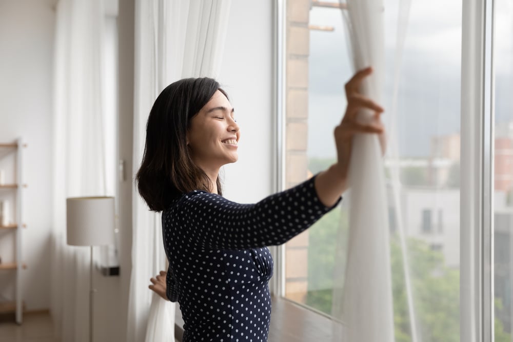 smiling asian woman enjoying fresh air