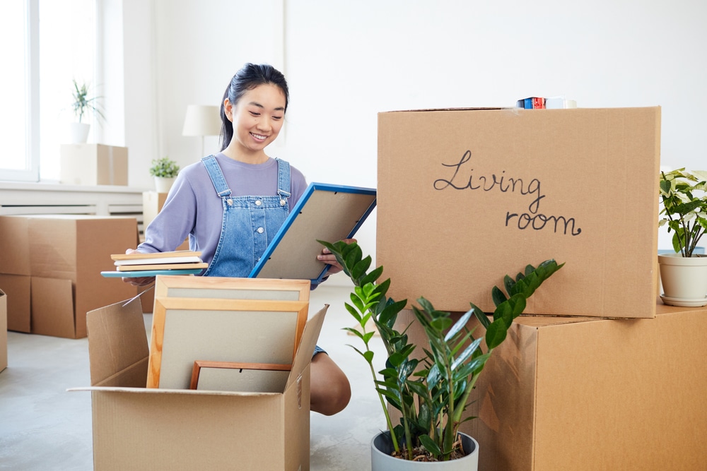 woman packing belongings for moving