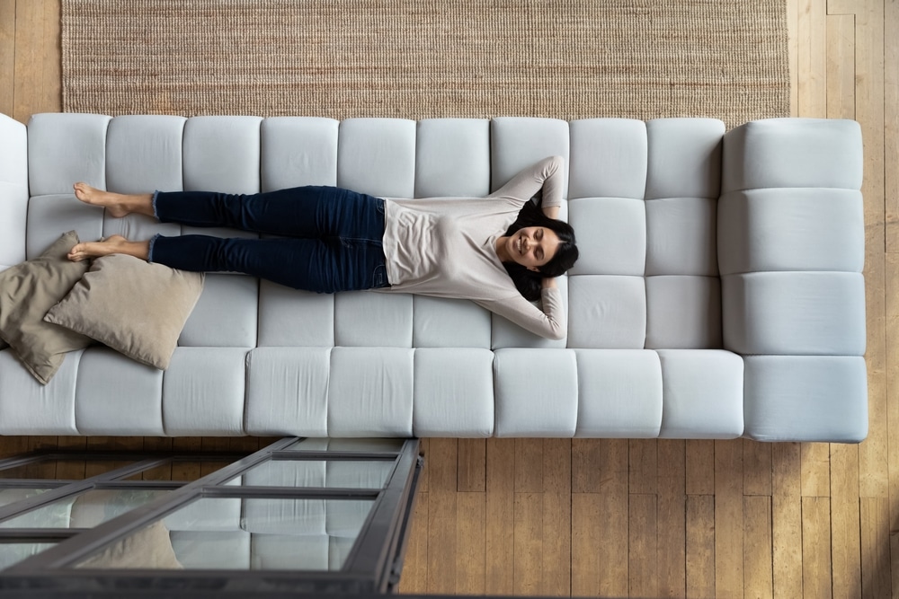 woman relaxing during a hot day inside condo