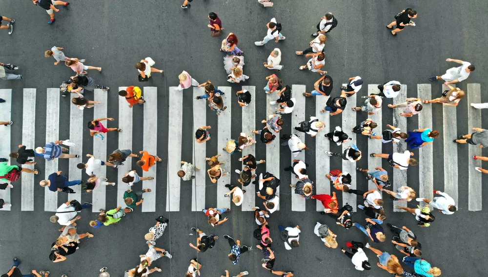 top view of people crossing a city street