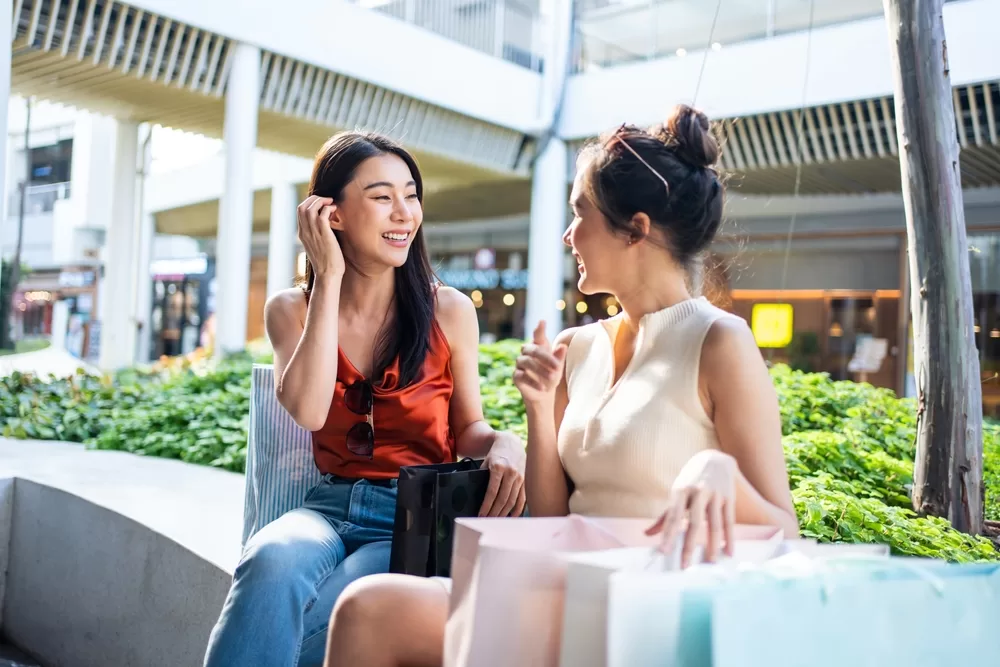 two females socializing in a space near their home