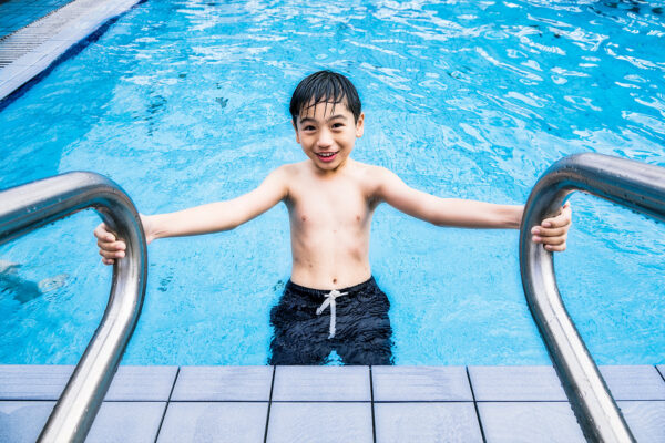 kid playing in the pool