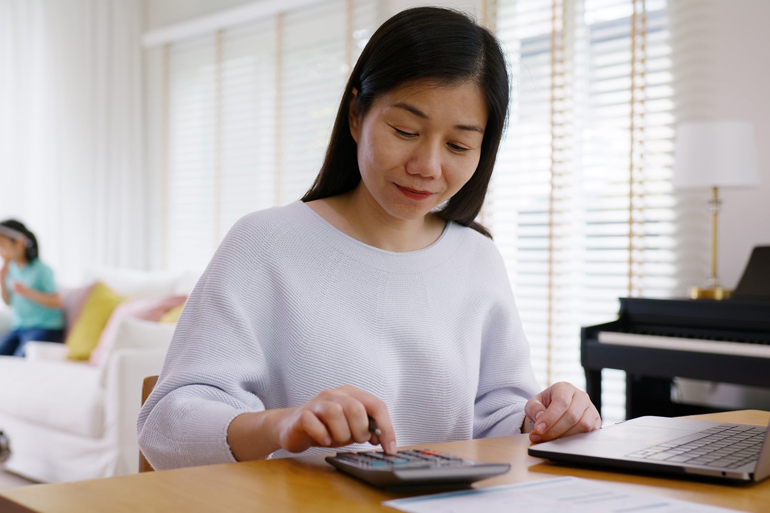 woman calculating her finances